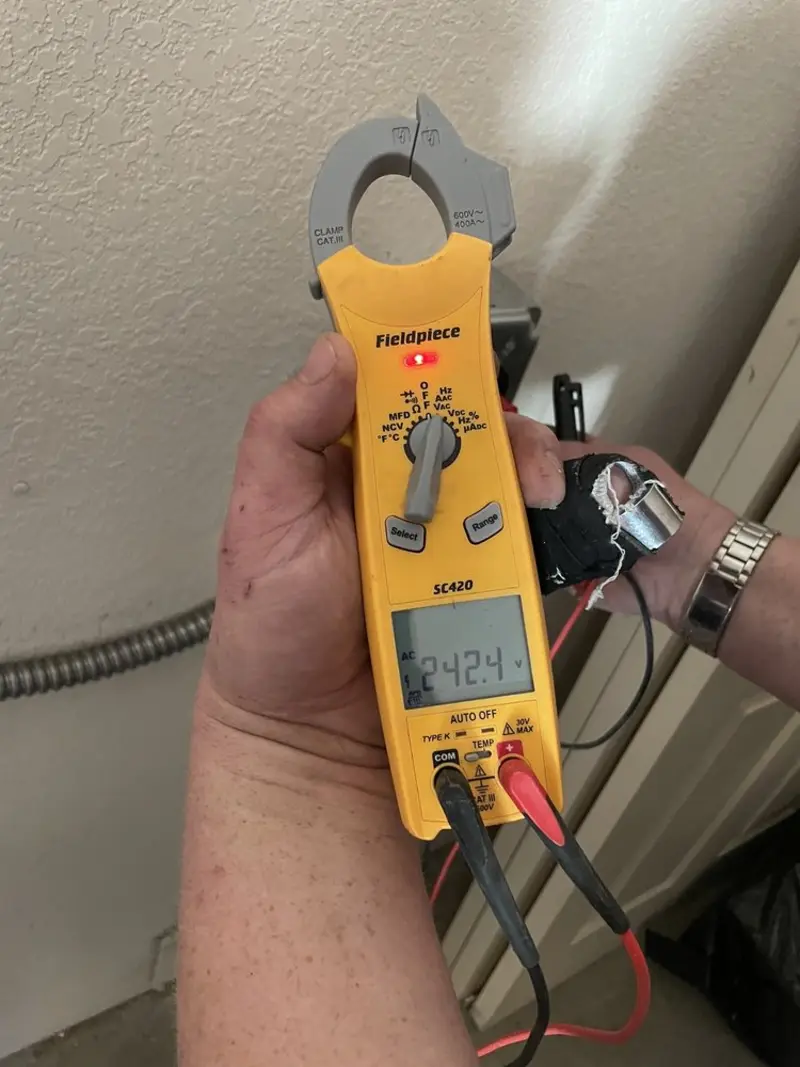 Voltage testing with clamp meter during Whole House Surge Protector in South Run